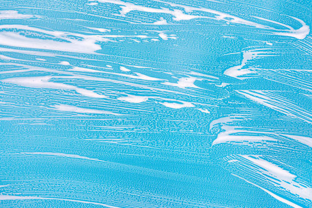 istock Cleaning background texture - chemical soap detergent foam on a clear glass 1254626652