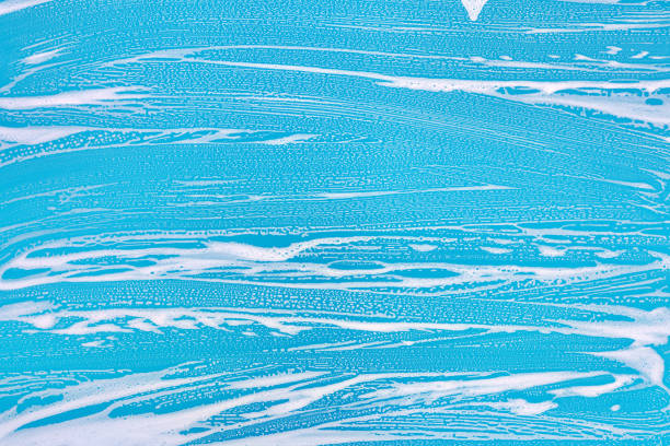 istock Cleaning background texture - chemical soap detergent foam on a clear glass 1254626678