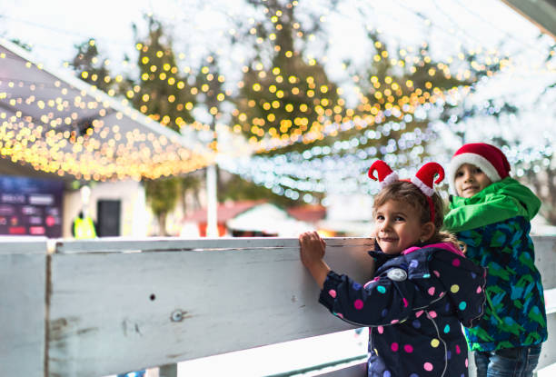 istock Beautiful children enjoying ice-skating 1254628085