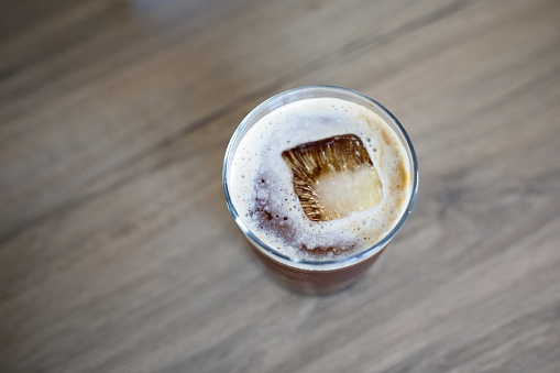 Close up glass of iced black Americano coffee