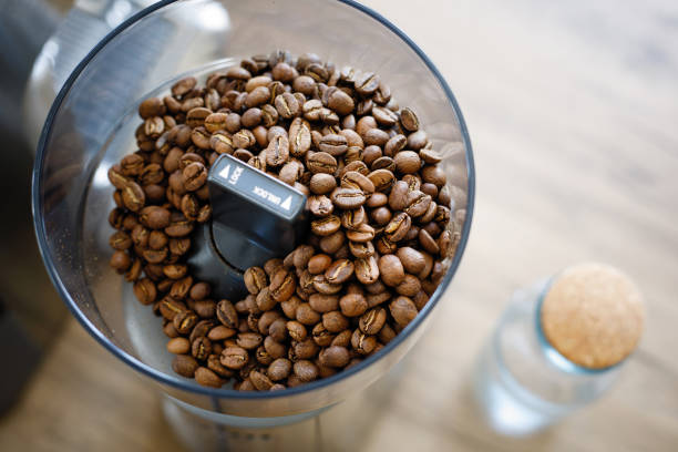 Close up coffee beans in grinder