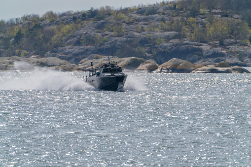 gothenburg, Sweden- April 24: CB90-class fast assault craft in the southern archipelago driving fast.