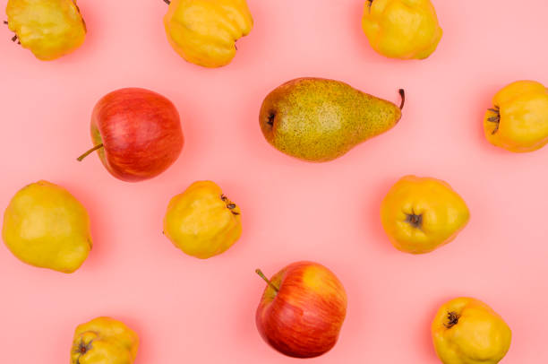 istock Autumn pears, apples, quince on a pink background. 1254631281