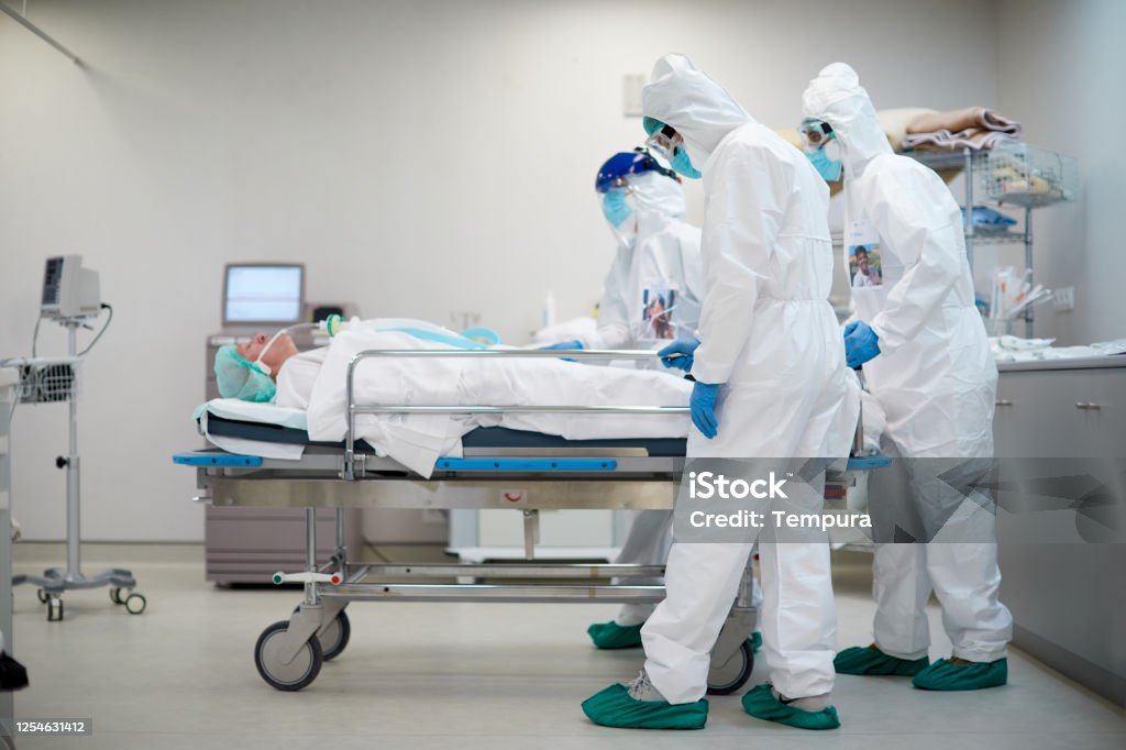 Tired and sad healthcare workers pushing a hospital gurney Hospital COVID
Tired and sad healthcare workers pushing a hospital gurney Death Stock Photo
