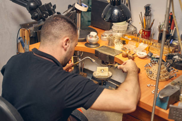 istock Male worker treating a pendant on the fire brick 1254632256