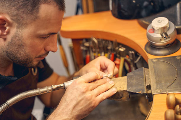 istock Male jeweler working with a hand tool 1254632299