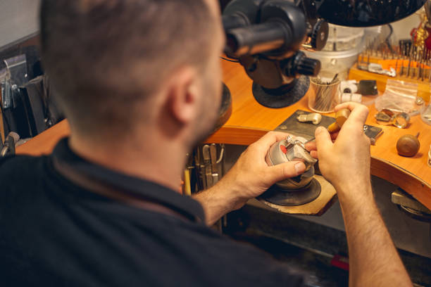 istock Craftsman setting pheonites in a jewelry item 1254632319