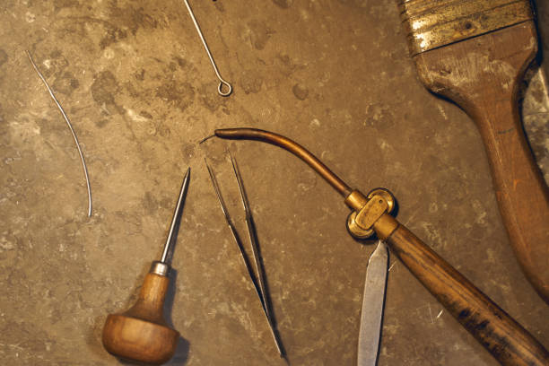 istock Set of jewelry tools on a fire brick 1254632335