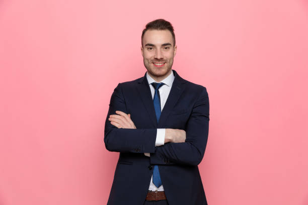 istock attractive young businessman in suit smiling 1254632490