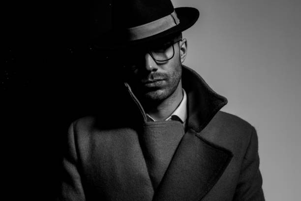 istock sexy young elegant man wearing hat and glasses 1254634217