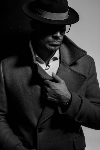 istock sexy young elegant man wearing hat and glasses 1254634272
