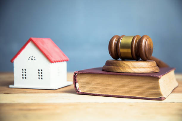 istock house model with judge on book 1254634324