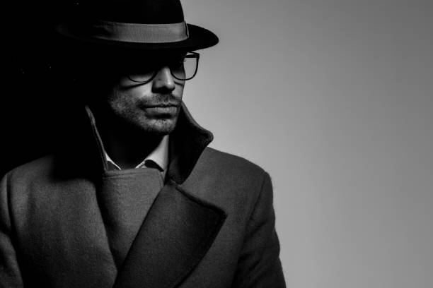 istock mysterious young man wearing hat and glasses 1254634497