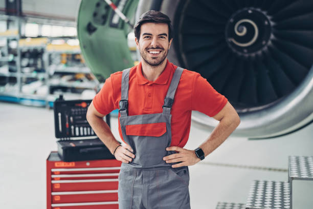 istock Airplane mechanic standing by a plane 1254636272