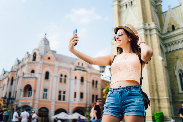 istock Female tourist making selfies 1254638386