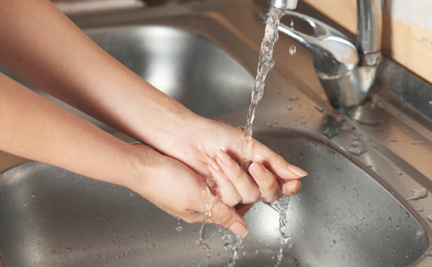 istock woman wash your hands 1254639798