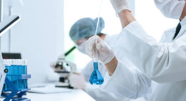 istock background image of a group of scientists in the laboratory 1254642151