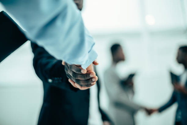 istock close up. image of a business handshake on an office background 1254647538