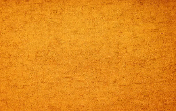 istock gold texture of rough putty on the wall. grunge background. 1254648745
