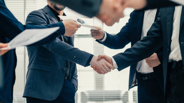 istock financial partners shaking hands. concept of cooperation 1254650796
