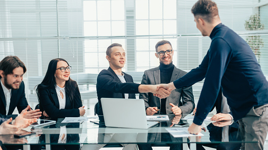 financial partners greeting each other at an office meeting. concept of cooperation