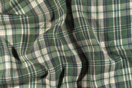 Closeup of a flannel fabric with a checkered pattern that can be used as a background