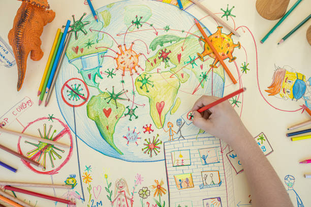 istock Kid is drawing planet Earth and covid-9 1254652371