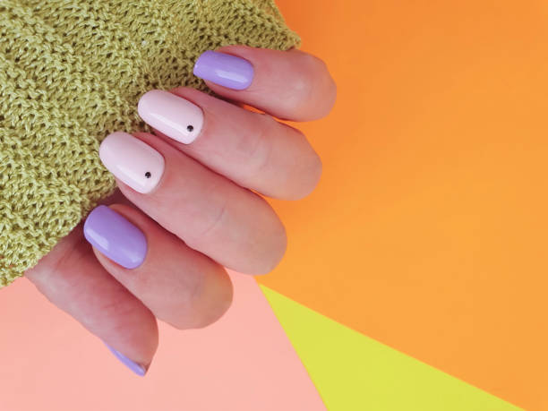 istock female hand nail beautiful manicure sweater 1254656479