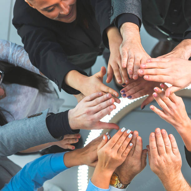 istock top view. group of young business people standing in a circle 1254656514