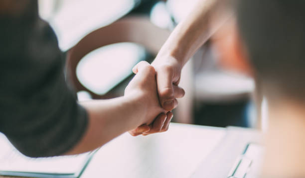 close up. image of a business handshake in the office stock photo