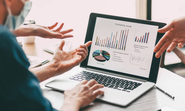 istock close up. group of employees discussing financial data 1254657367