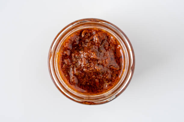 fresh homemade italian rosso red sundries tomato chili pesto sauce health food cook recipe made from spice pepper herb parmesan cheese nuts for healthy vegetarian vegan meal - tomato curry imagens e fotografias de stock