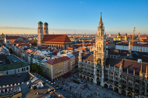 Aerial view of Munich, Germany Aerial view of Munich - Marienplatz, Neues Rathaus and Frauenkirche from St. Peter's church on sunset. Munich, Germany munich city hall stock pictures, royalty-free photos & images