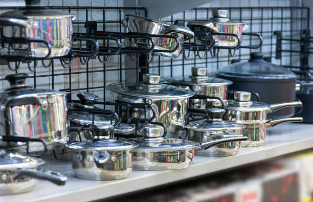 istock new stainless steel pots in a shelf 1254665131