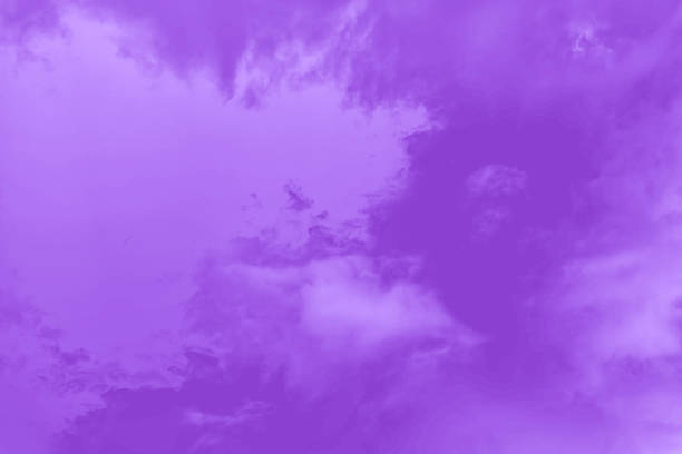 istock Purple fluffy clouds in the sky. Violet sky background 1254670964