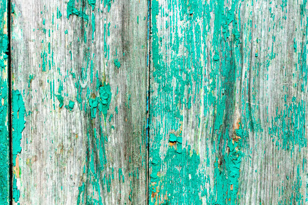 istock Old rustic painted cracky green, turquoise wooden texture or background 1254671515