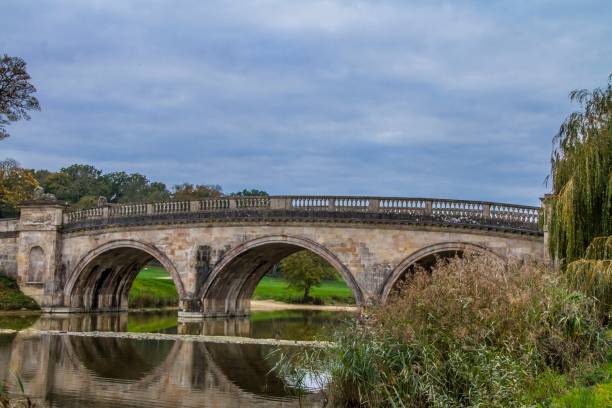istock Bridge In Autumnal Rural England. 1254671703