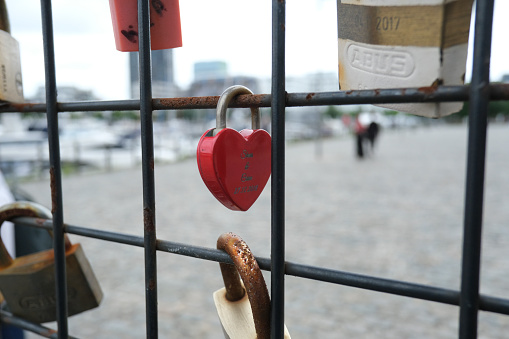 Love locks placed by tourists on fence in port of  Antwerp, Belgium on July 4, 2020.
