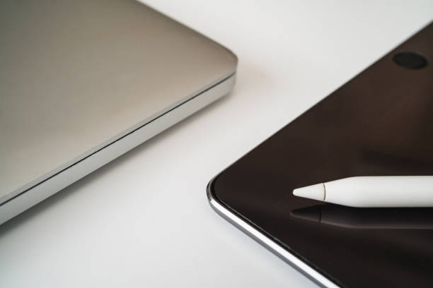 istock Flat lay composition with laptop and tablet on white background. Home office 1254672897