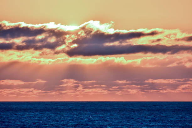 istock The Sun Setting in the Sea 1254673049