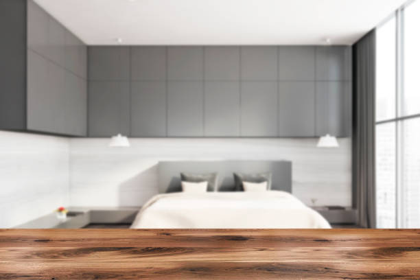 istock Table in gray and white bedroom 1254673636