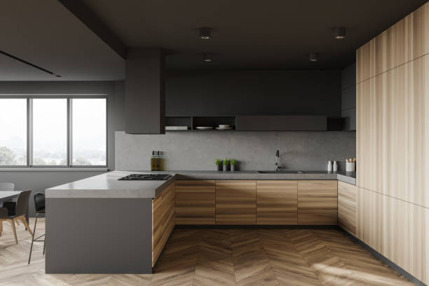 istock Gray and wood kitchen with bar, side view 1254673789