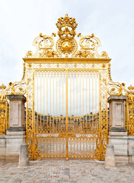 Château de Versailles : the beautiful golden gate, without people, during epidemic Covid 19 virus. It was an official residence of the kings of France and is now a World Heritage Site.  Versailles, near Paris in France. June 27, 2020