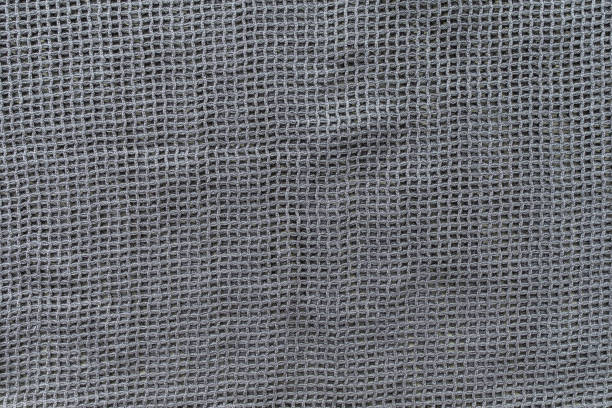 istock Gray eco shopping bag texture background. Close-up 1254678201