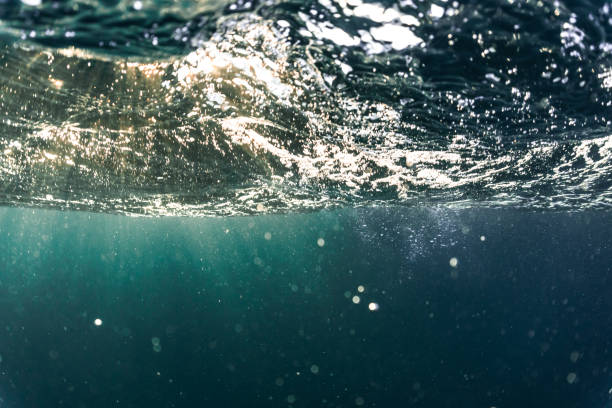 istock Rays of sunlight refracting through the surface of the deep, blue mediterranean sea. 1254678938