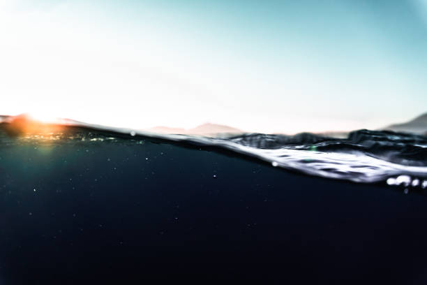 Rays of sunlight refracting through the surface of the deep, blue mediterranean sea.