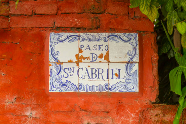 Details of street sign painted in a tile in Colonia del Sacramento historic district in Uruguay. Details of street sign painted in a portuguese tile in Colonia del Sacramento historical district city in southwestern of Uruguay
Colonia Del Sacramento, in Uruguay, is a Unesco World Heritage town, known for its cobblestoned historic district, which is lined with buildings from its time as a Portuguese settlement in the 19th-century. The street signs are done in Portuguese tiles, which give a lot of character to the place. ceramic tile house numbers stock pictures, royalty-free photos & images
