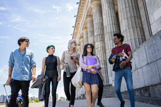 istock Group of students traveling with a professor 1254683602