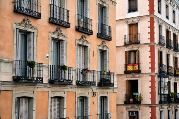 istock Facade of old buildings with balconies 1254688741