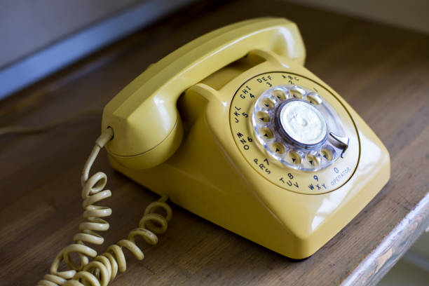 istock Old yellow phone 1254694622